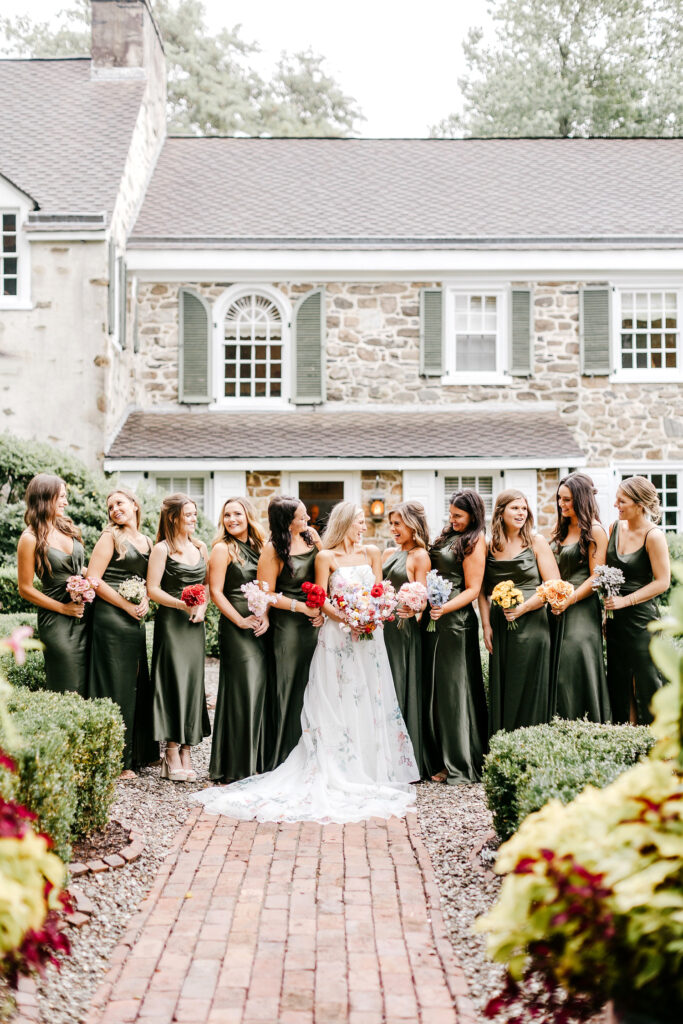 bride with bridesmaids in forest green bridesmaid dresses at Appleford Estate