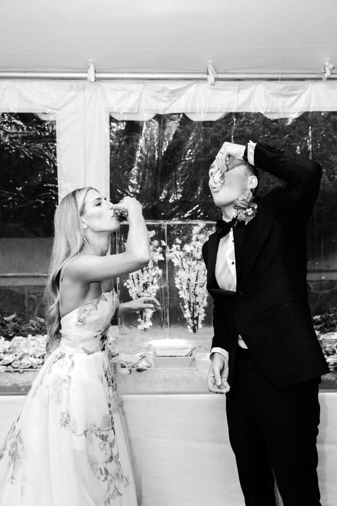 bride & groom taking shots before their wedding reception by Emily Wren Photography