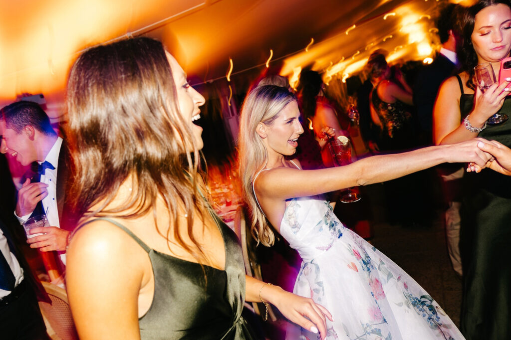 bride dancing at her late summer wedding reception at Appleford Estate by Emily Wren Photography