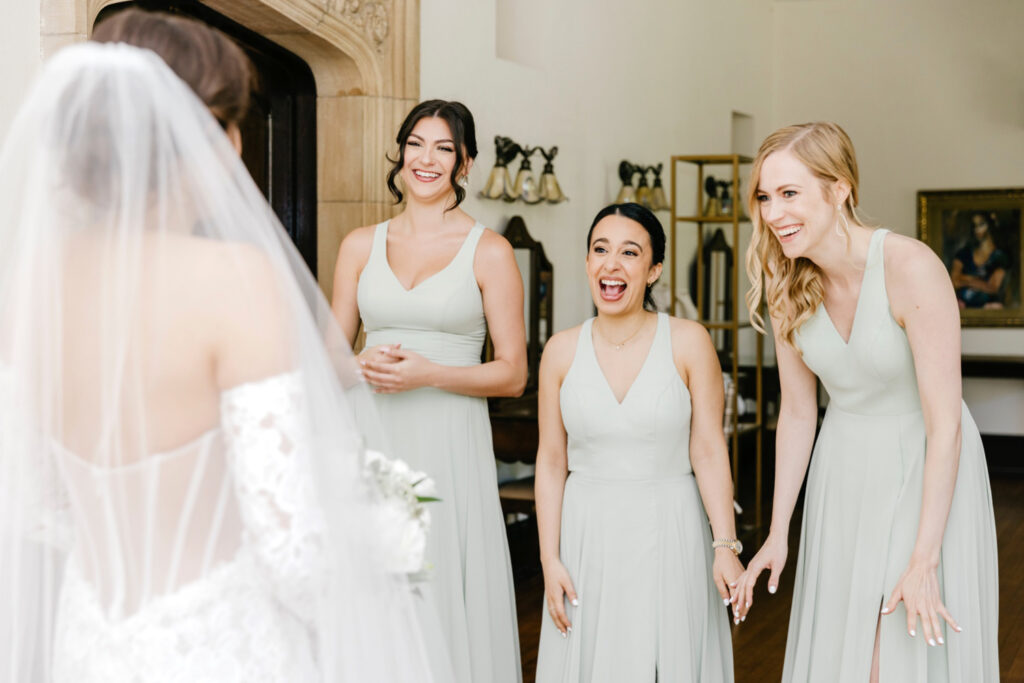 brides first look with her bridesmaids at Parque at Hunting Hill Mansion