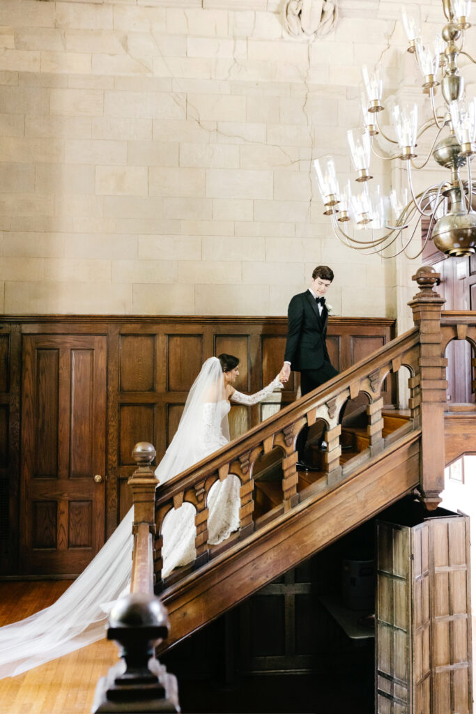 timeless wedding portrait of bride and groom walking up the stairs at Parque Ridley Creek