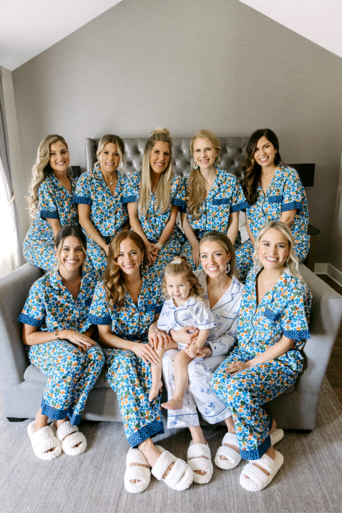 bride with bridemaids and flower girl in matching pajamas and slippers by Emily Wren Photography