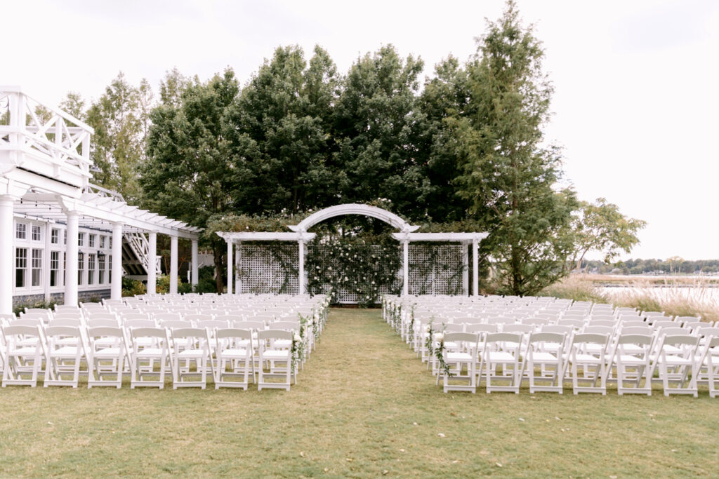 Waterfront wedding ceremony at Chesapeake Bay Beach Club in Maryland by Emily Wren Photography