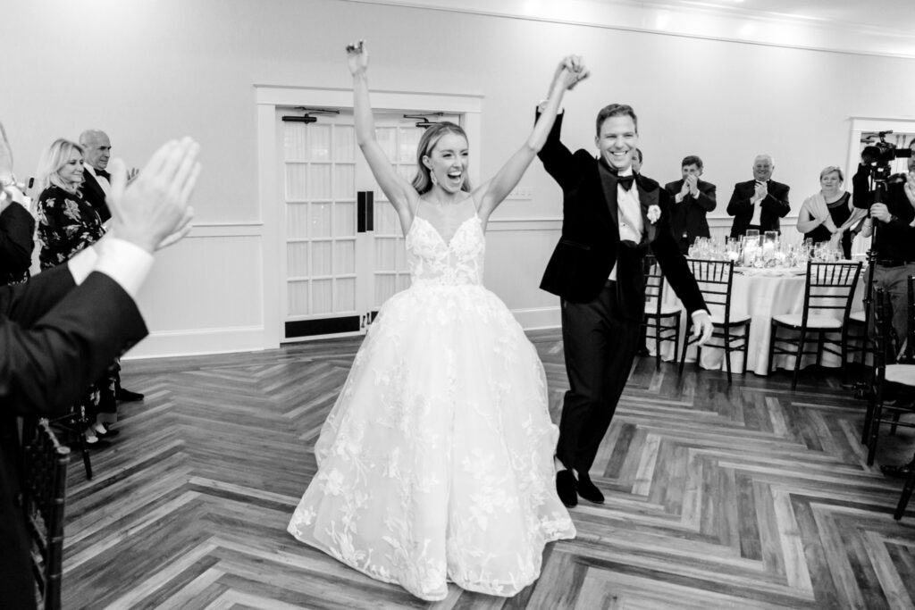 bride & groom entering their Chesapeake Bay Beach Club wedding reception