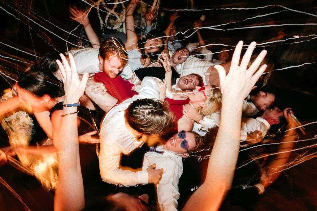 human dogpile at fun New Jersey wedding reception by Emily Wren Photography