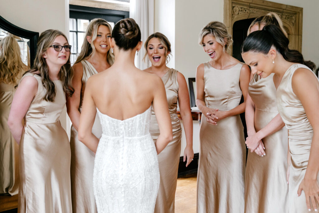 brides first look with her bridesmaids