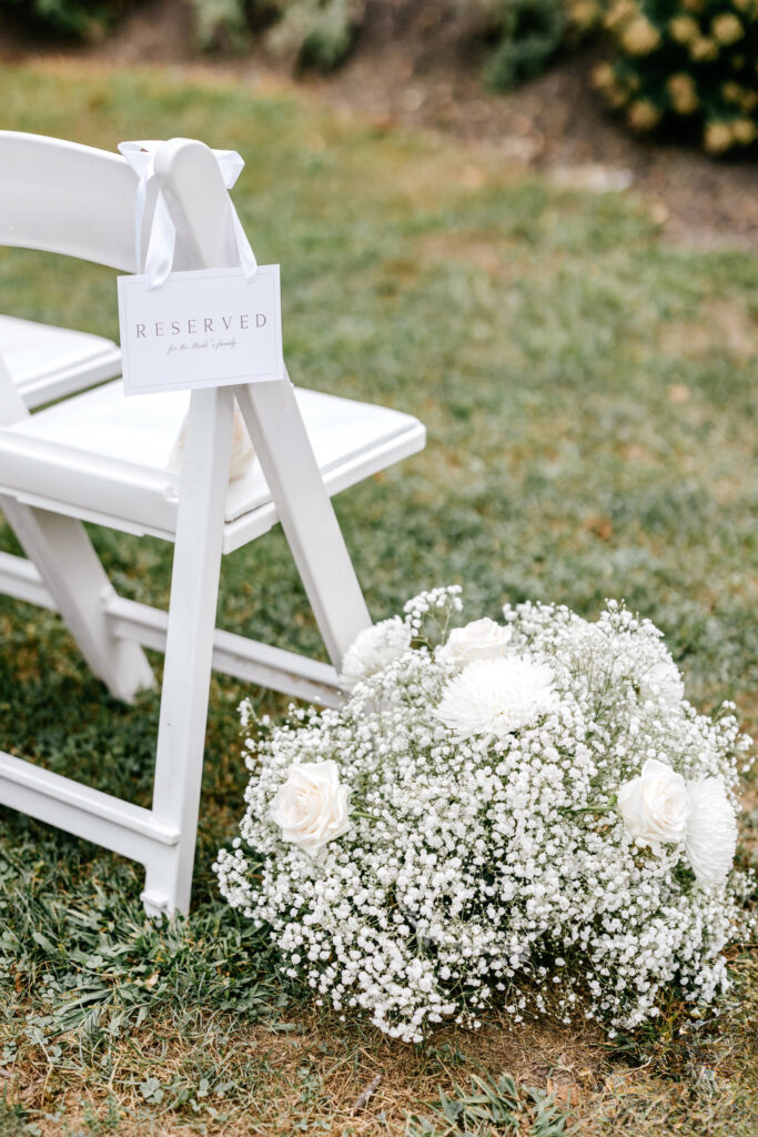 babies breath bouquet aligning wedding aisle for outdoor wedding ceremony