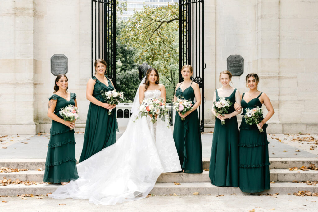 bride with bridesmaids in dark green bridesmaid dresses