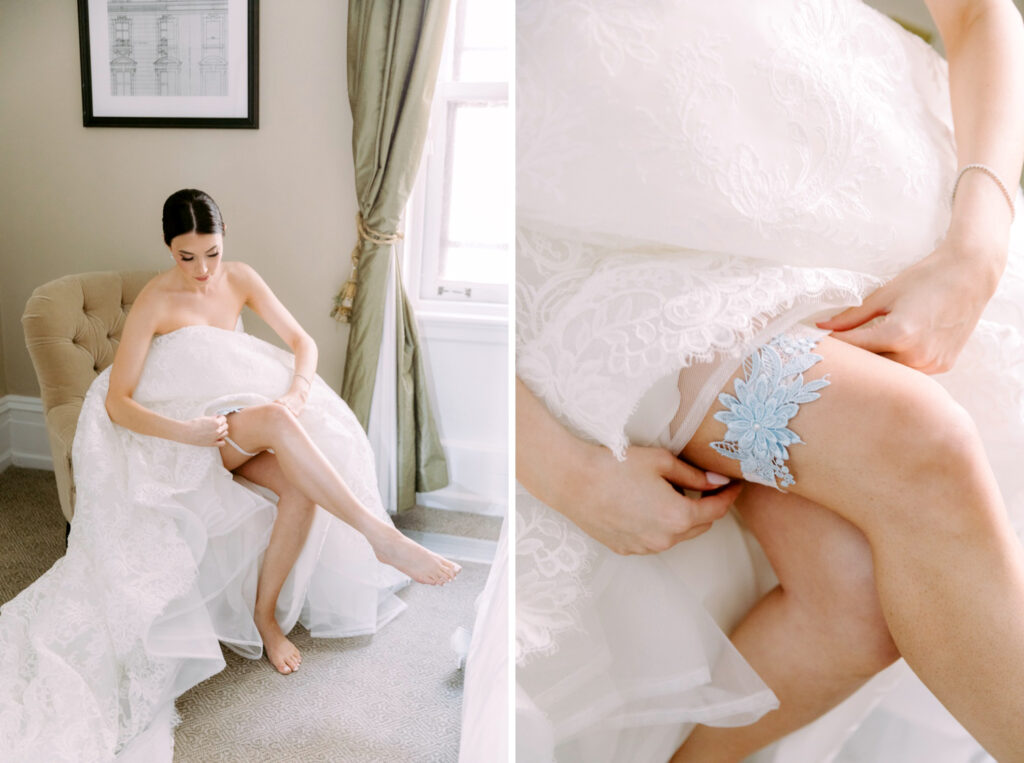 bride putting on her blue wedding garter by Philadelphia photographer Emily Wren Photography