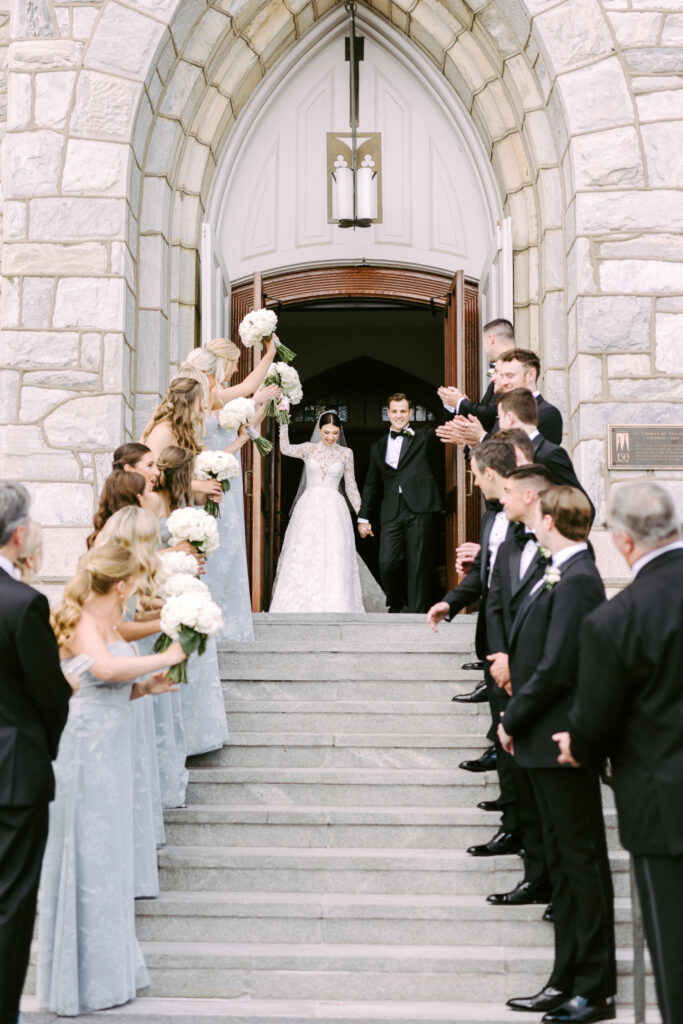 bride & grooms wedding ceremony exit from St. Thomas of Villanova Church by luxury wedding photographer Emily Wren Photography