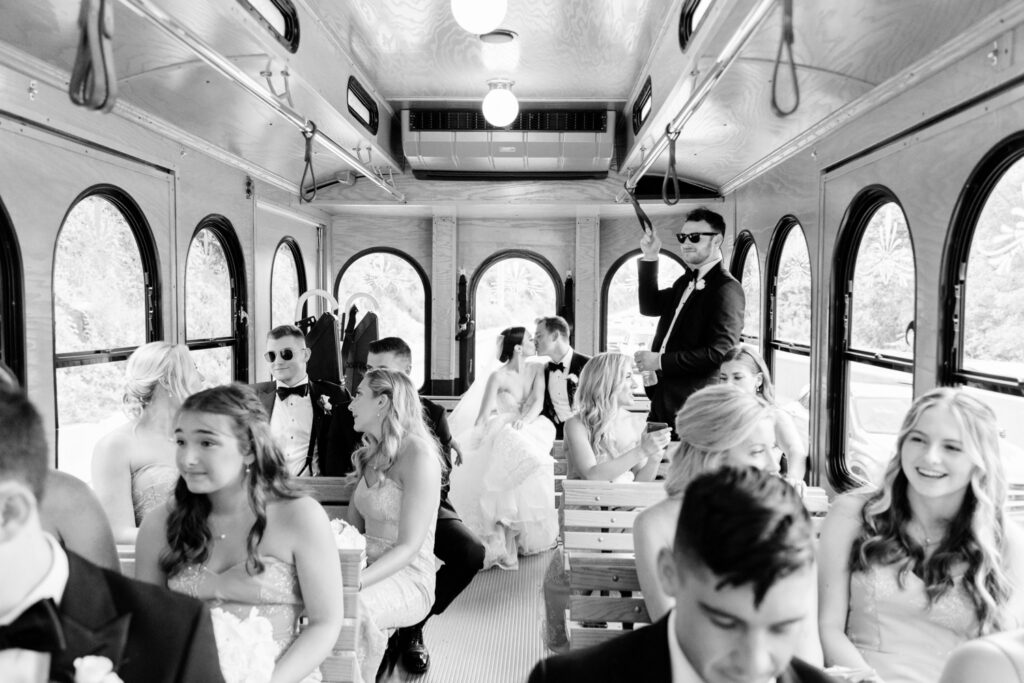 Villanova bride & groom on their wedding party bus by Emily Wren Photography