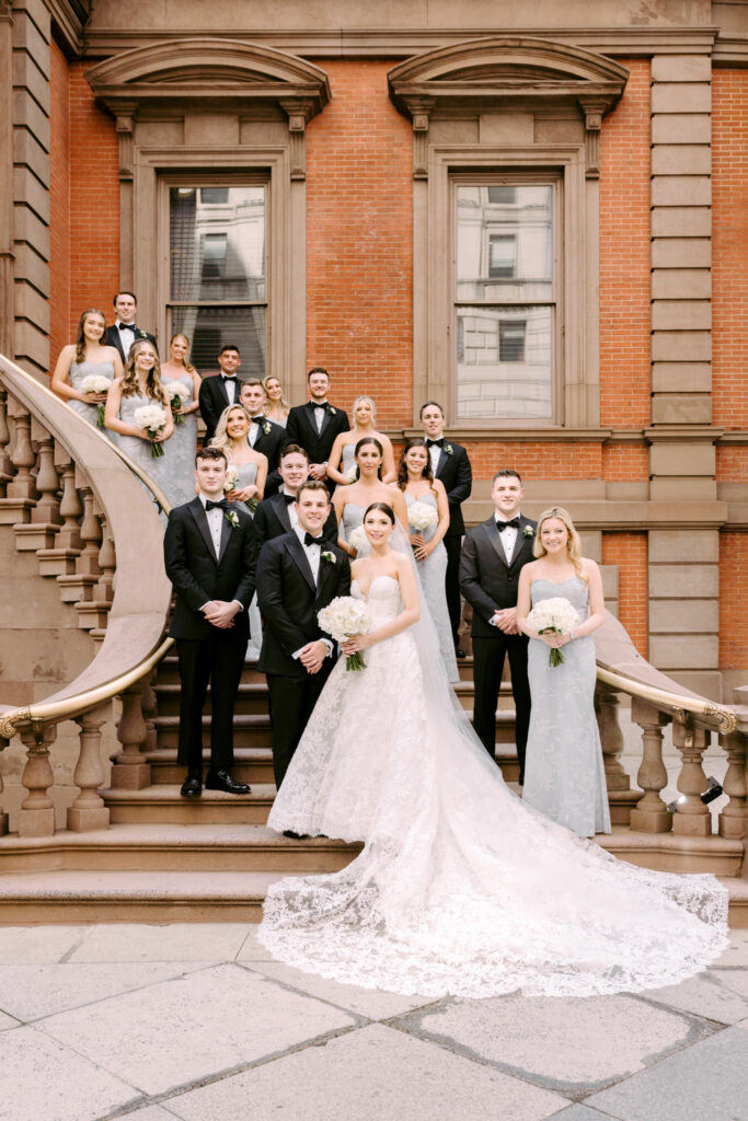 Full wedding party on the stairs of The Philadelphia Union League by Emily Wren Photography