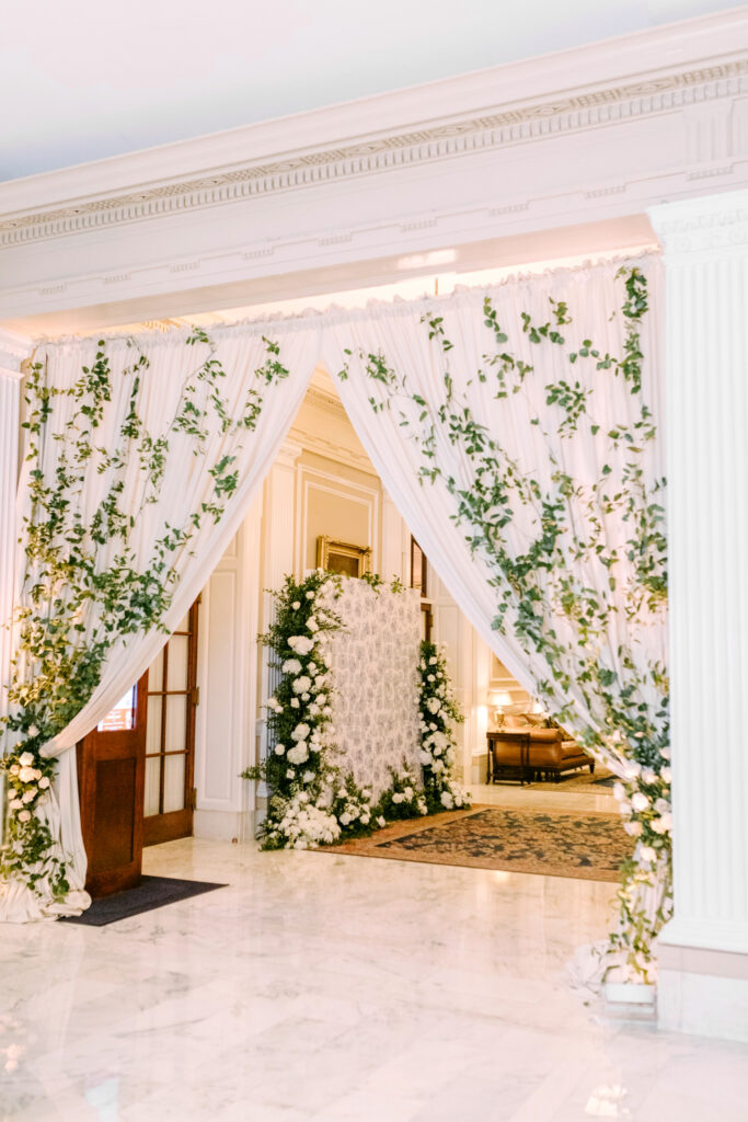 vines and greenery wedding reception entrance by Emily Wren Photography