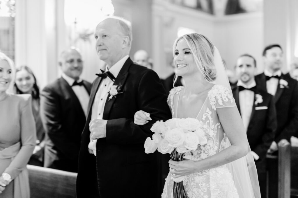 bride walking down the aisle of New Jersey church by Emily Wren Photography