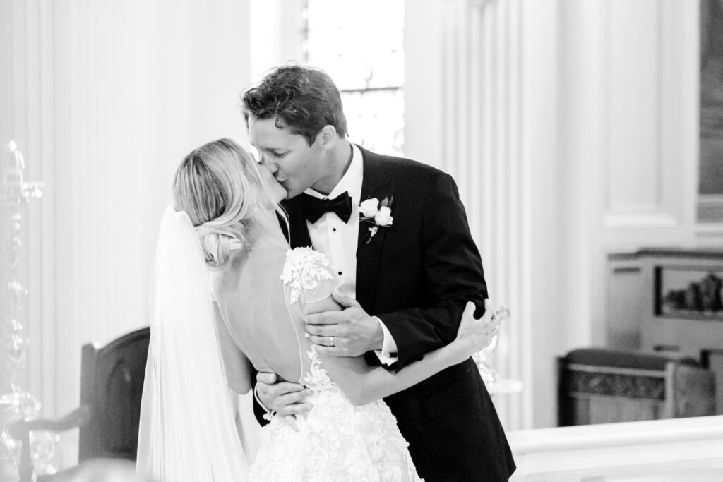 bride & grooms first kiss at wedding ceremony by New Jersey wedding photographer Emily Wren Photography