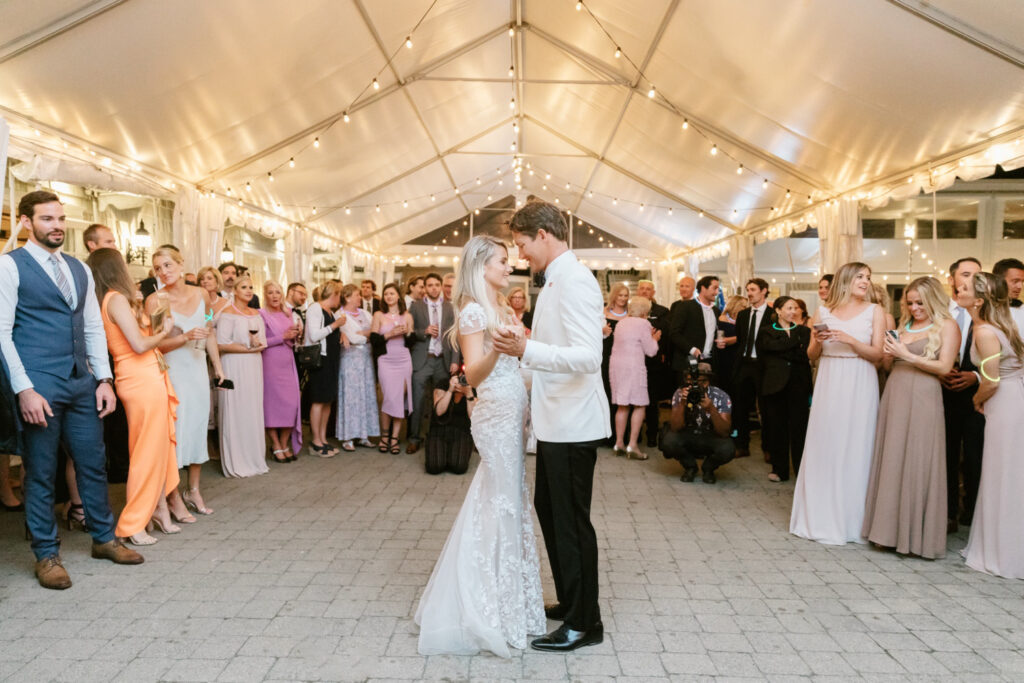 New Jersey bride & grooms first dance at Spring Lake Tennis and Bath Club wedding reception under a white tent with string lights