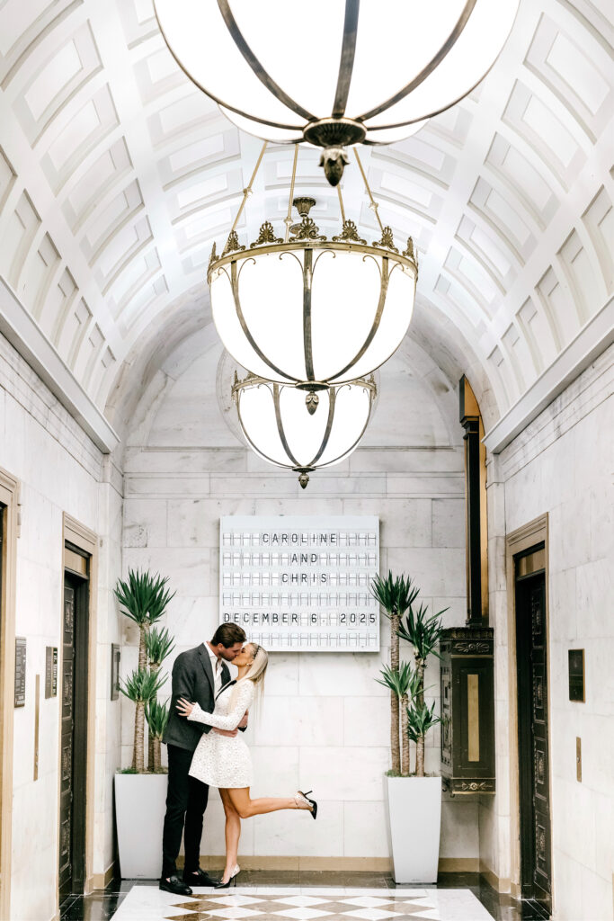 Engagement photo session at The Ritz Hotel in front of marquee with the couples names and wedding date by Philadelphia photographer Emily Wren Photography