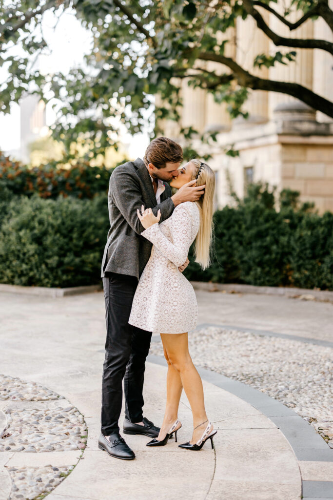 Couple kissing at the Philadelphia art museum during their engagement session by Emily Wren Photography