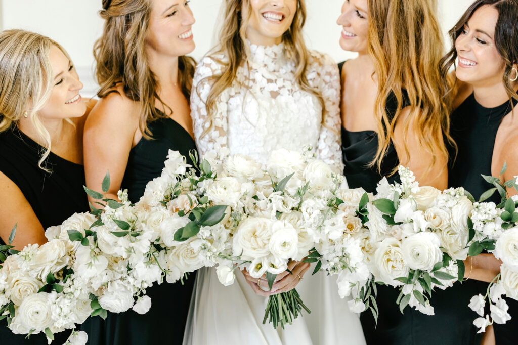 all white bridal and bridesmaid bouquets by Emily Wren Photography