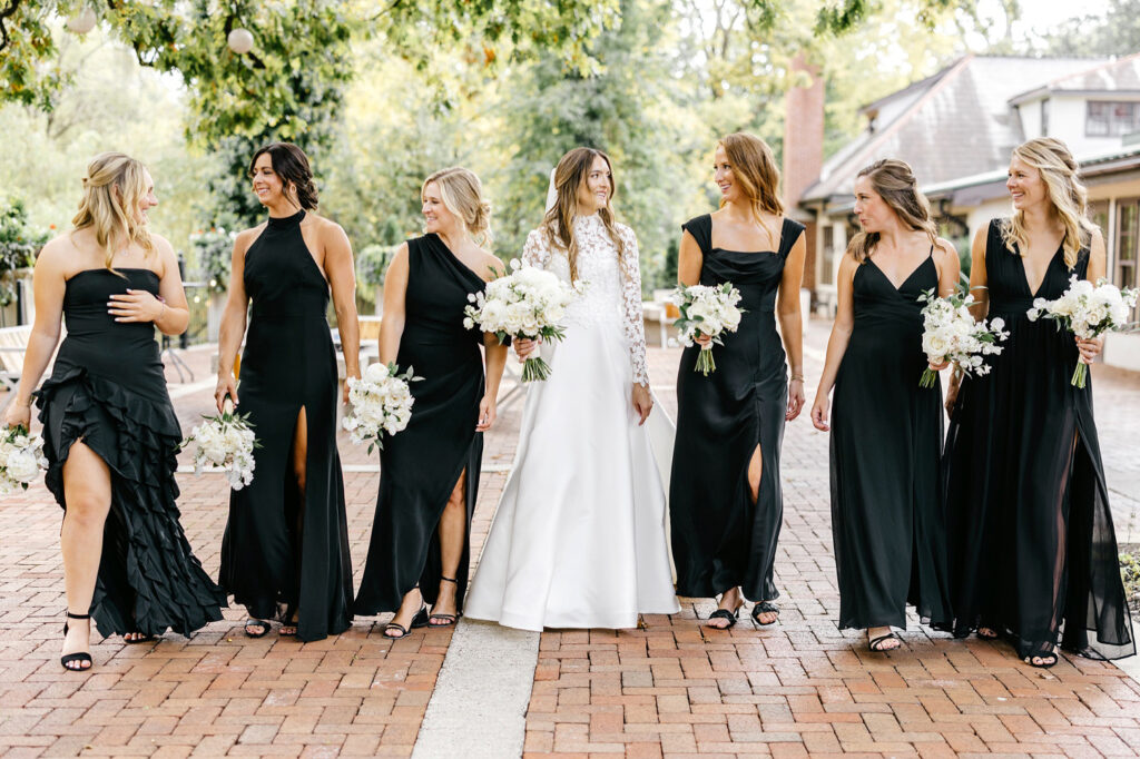 Pennsylvania bride with her bridesmaids in black bridesmaid dresses in New Hope