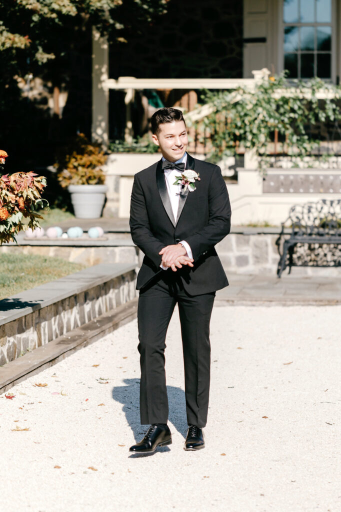 groom walking down the aisle at The inn at Grace Winery wedding ceremony