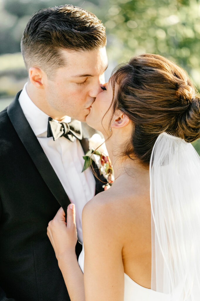 bride and groom kissing portrait at The Inn at Grace Winery