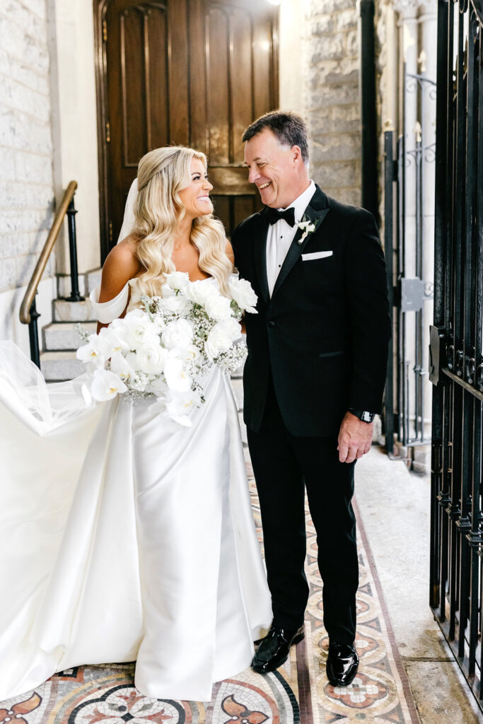 bride with her father before walking down the aisle at Center City Philadelphia wedding ceremony