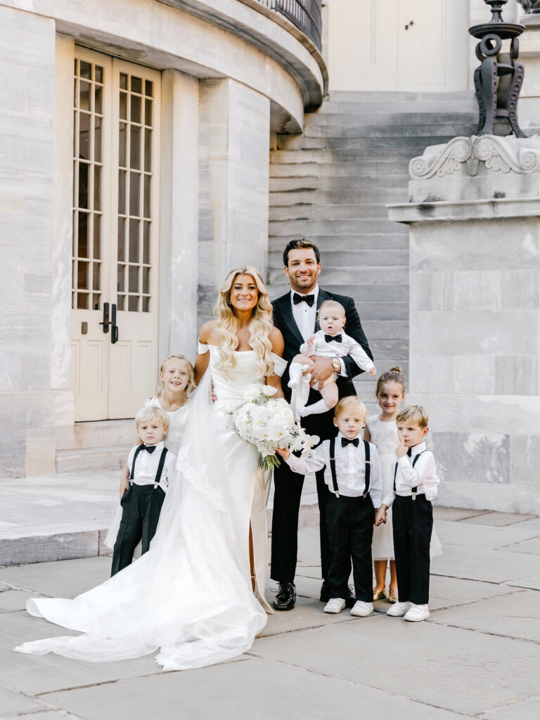 portrait of bride and groom with flower girls and ring bearers in Center City Philadelphia