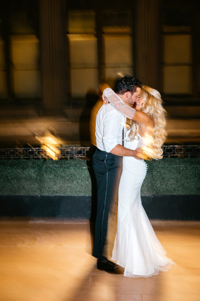 bride and groom kissing at their Ballroom at the Ben wedding. reception by Emily Wren Photography