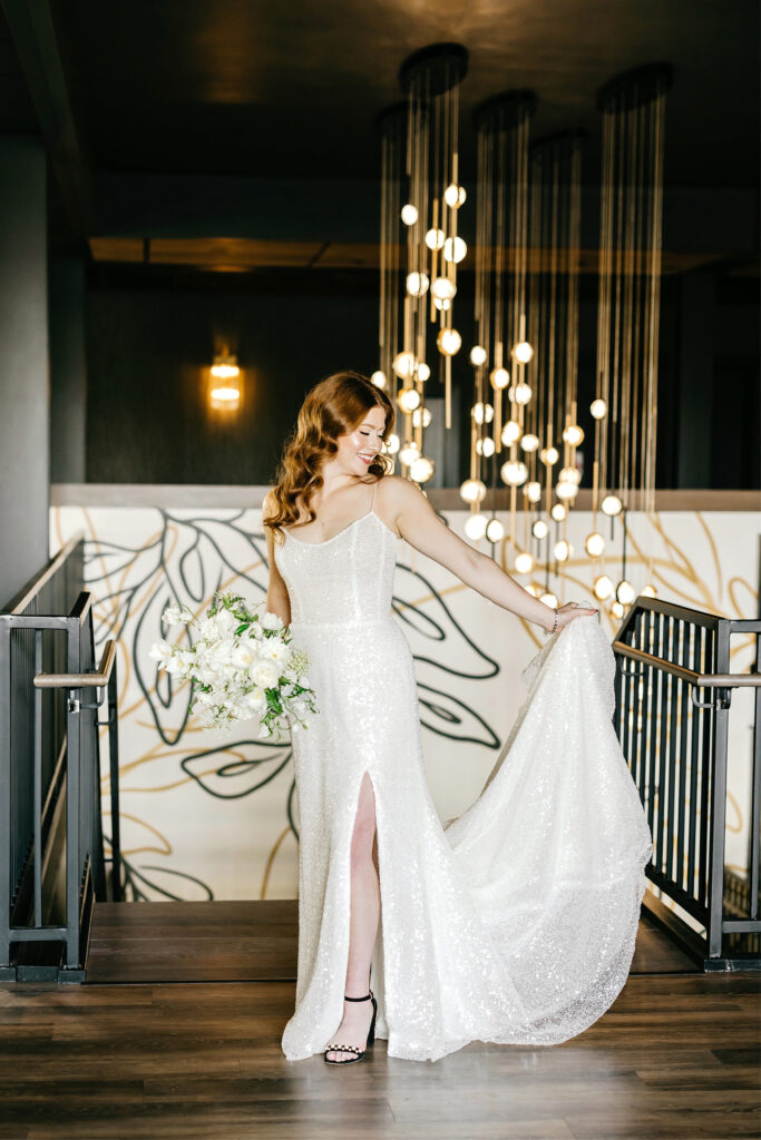 sequin Van Cleve wedding dress with a thigh slit at The Ivy wedding venue by Emily Wren Photography