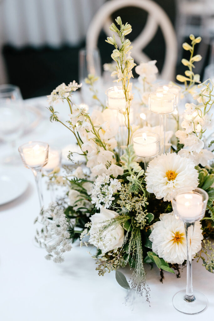 all white floral table centerpieces for Pennsylvania wedding reception at The Ivy by Finley Catering