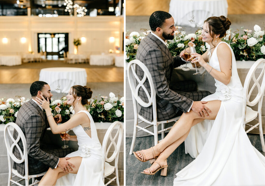 bride and groom drinking champagne at sweetheart table at The Ivy wedding reception ballroom by Emily Wren Photography