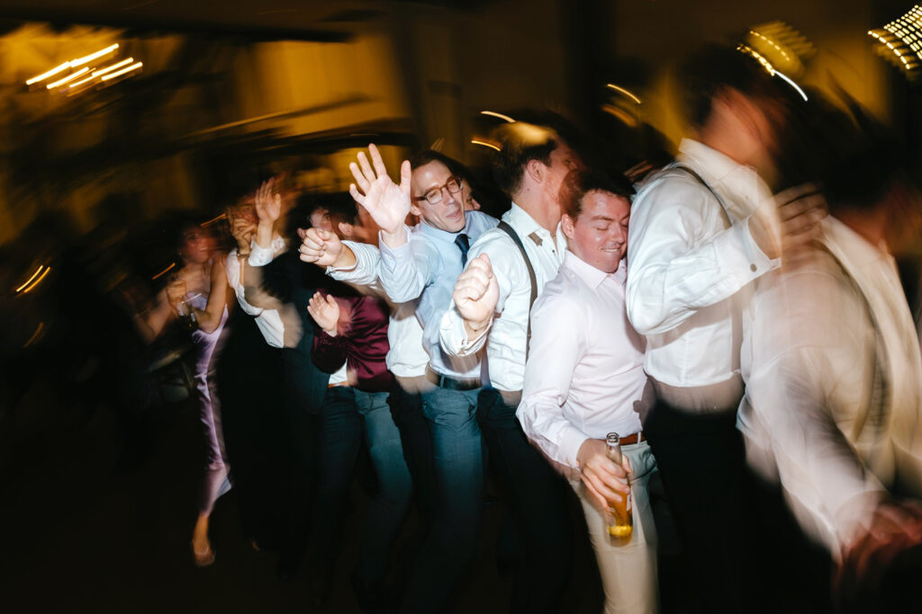 wedding reception conga line by Emily Wren Photography