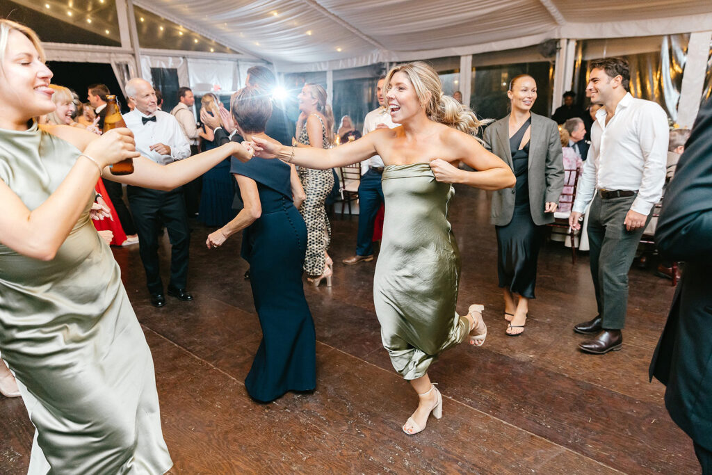 bridesmaids dancing at white tent fall Philadelphia wedding reception