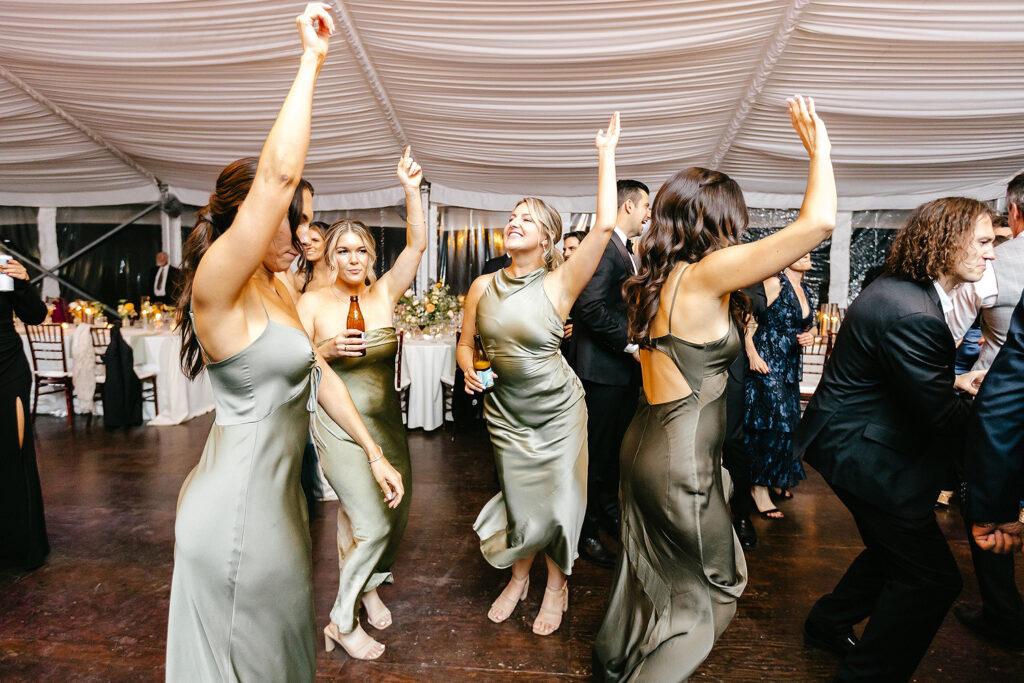 bridesmaids having fun at Glen Foerd wedding reception by Emily Wren Photography