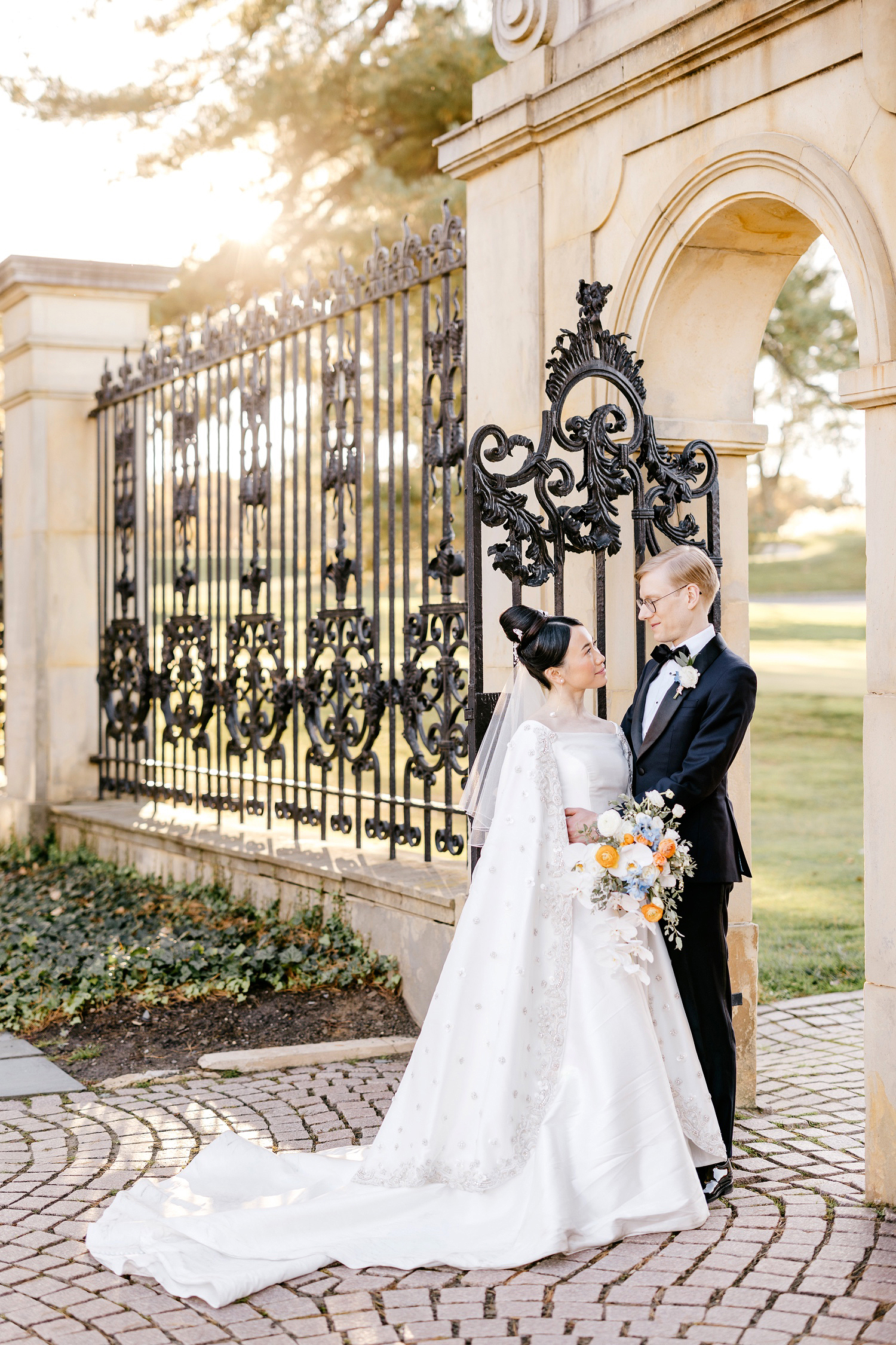 portrait of bride and groom at Jasna Polana's garden by Emily Wren Photography