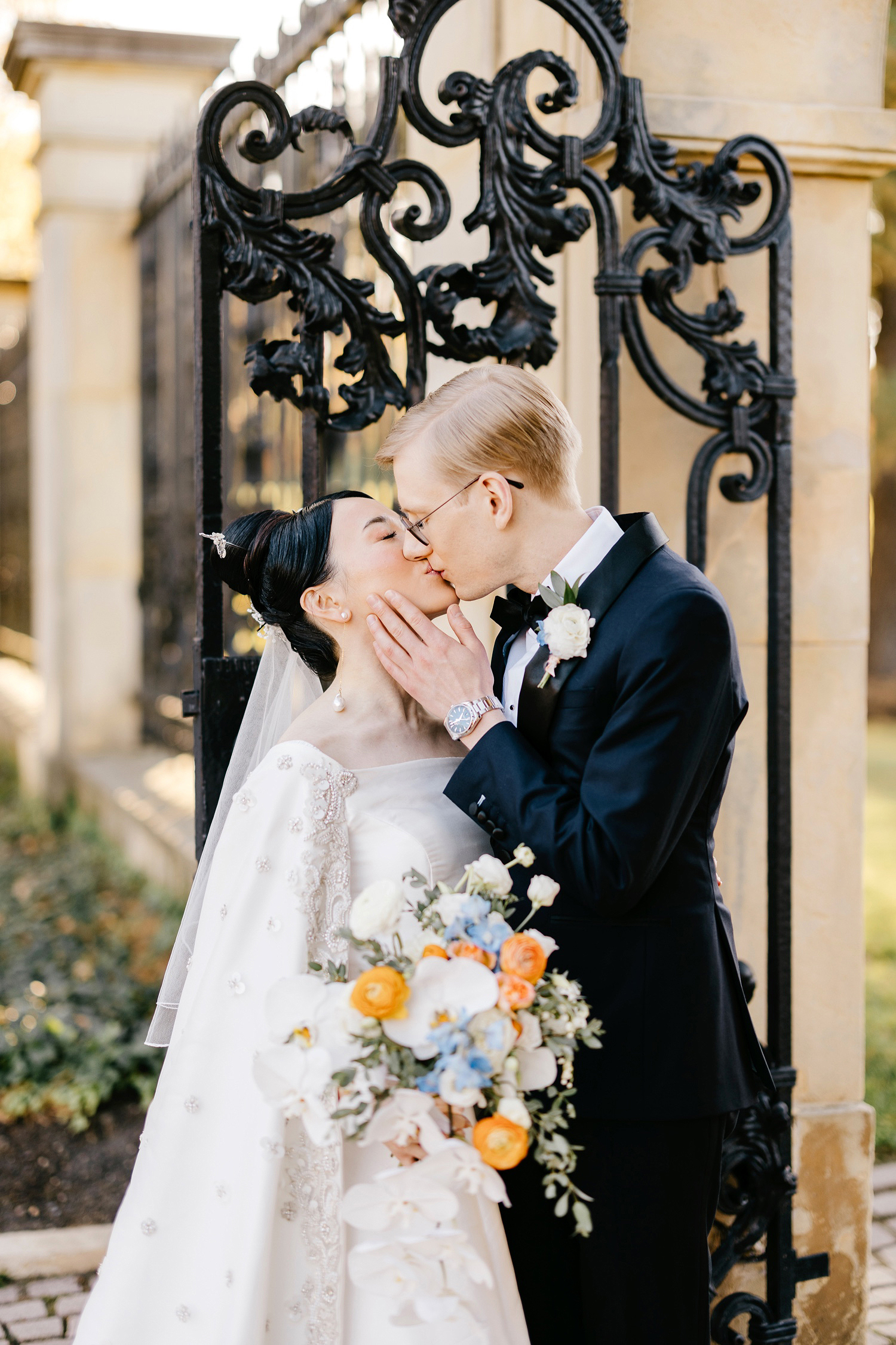 portrait of bride & groom kissing by Emily Wren Photography