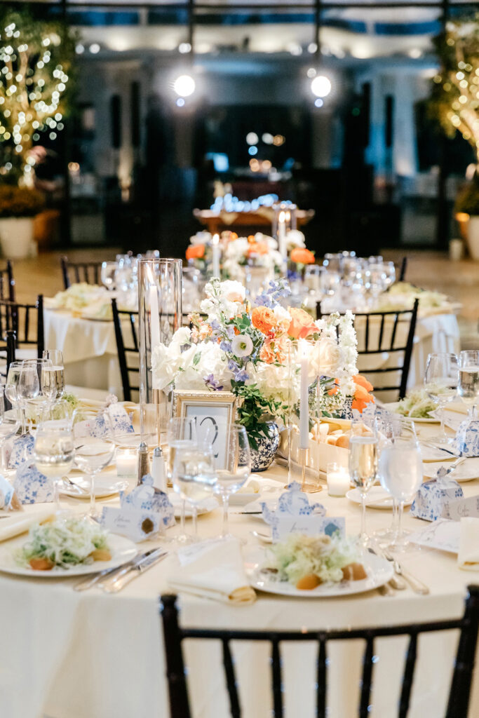 fall wedding reception tablescapes with blue white and orange florals