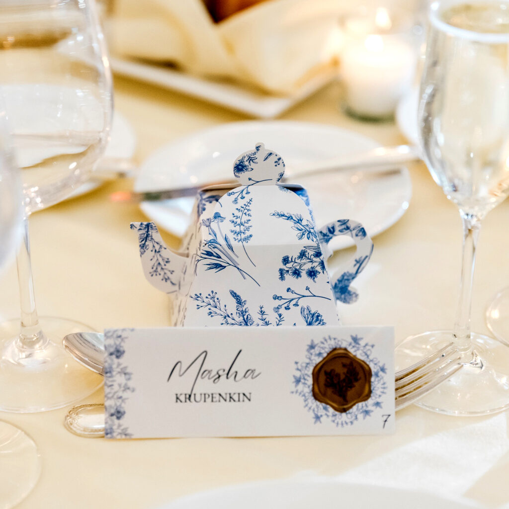 paper mache blue and white teapot for wedding reception name cards