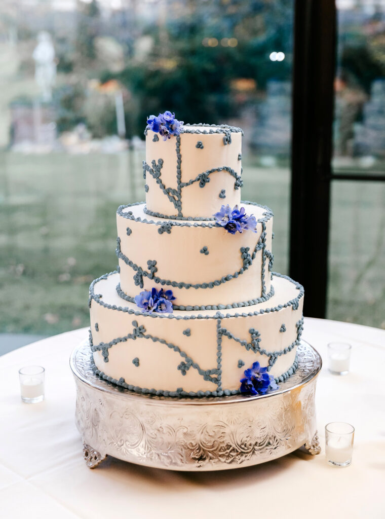 blue and white 3 tier wedding cake by Emily Wren Photography