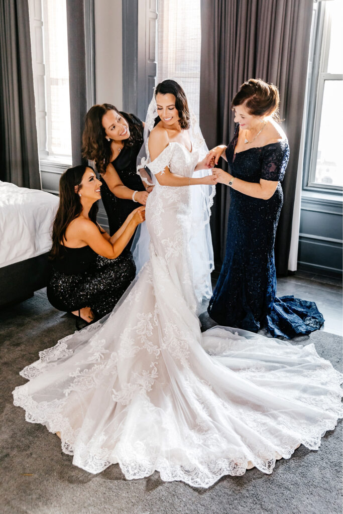 bride getting ready for her winter wedding day at Bellevue hotel by Emily Wren Photography