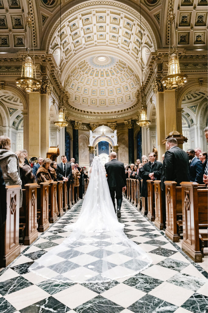 bride walking down the aisle at Cathedral Basilica of Saints Peter and Paul by Philadelphia wedding photographer Emily Wren Photography