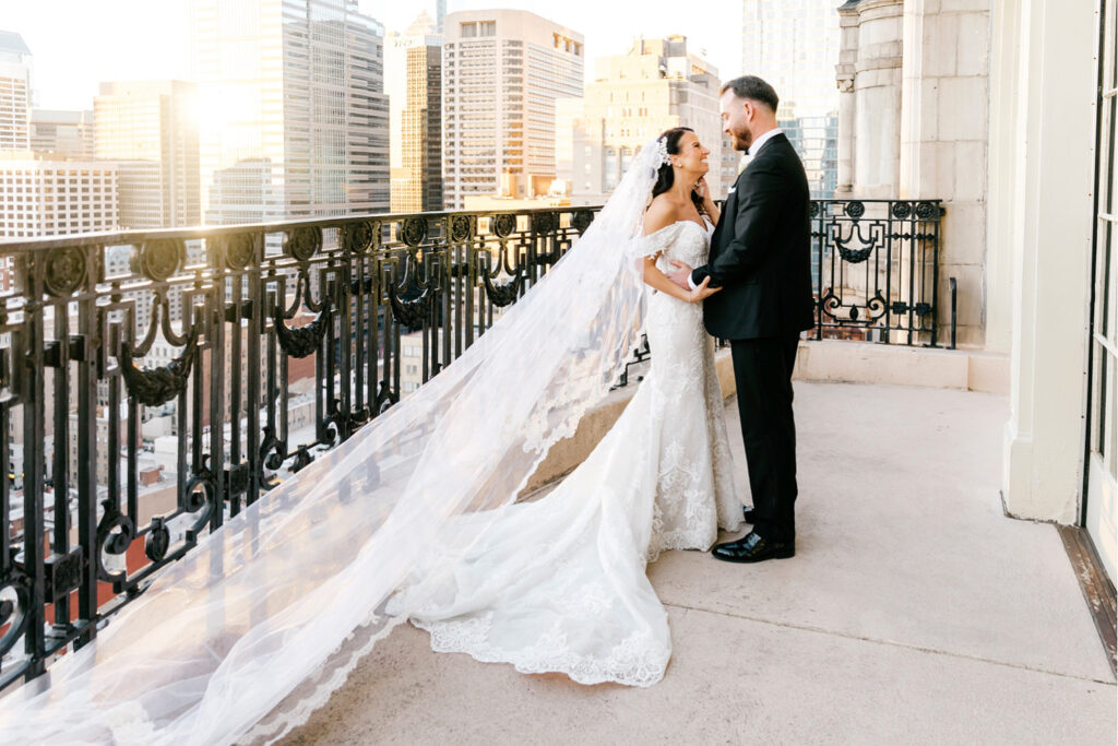 bride and groom rooftop balcony portrait in Philadelphia by Emily Wren Photography