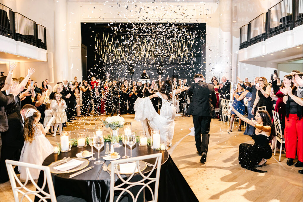 confetti bride & groom wedding reception entrance at The Grand Belle