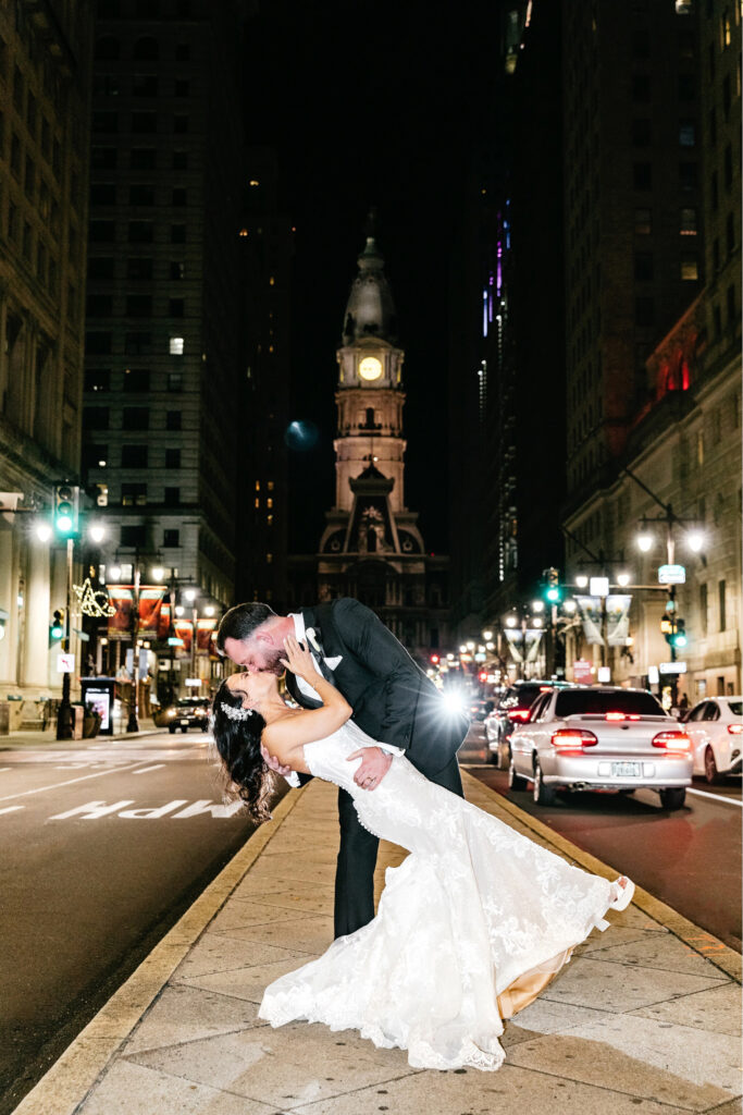 bride & groom night portrait in front of Philadelphia's City Hall