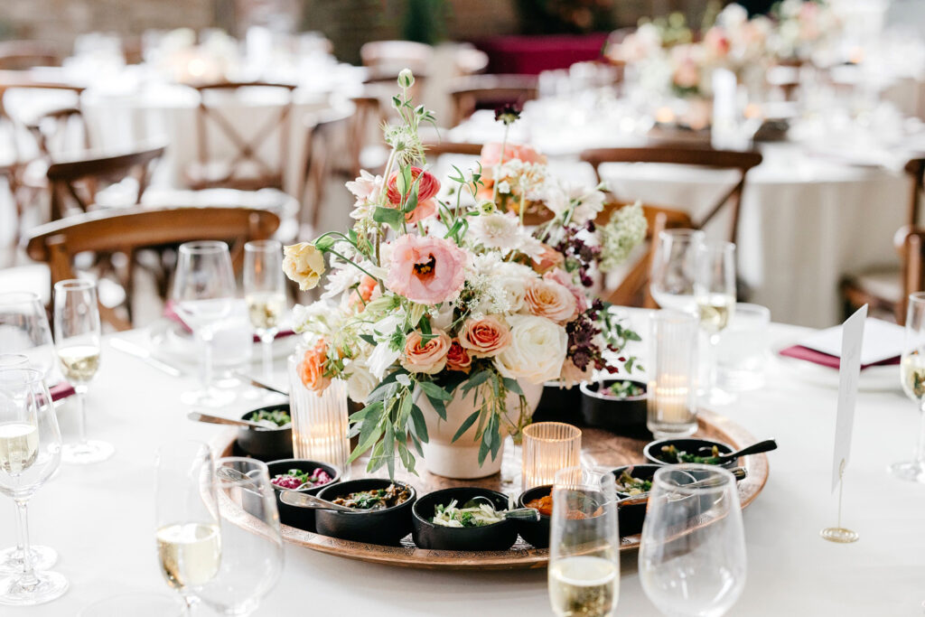 unique wedding reception table decor of flowers and small appetizers