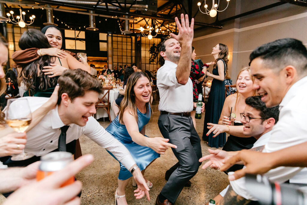 guests having fun at modern Philly wedding reception at Lilah by Emily Wren Photography