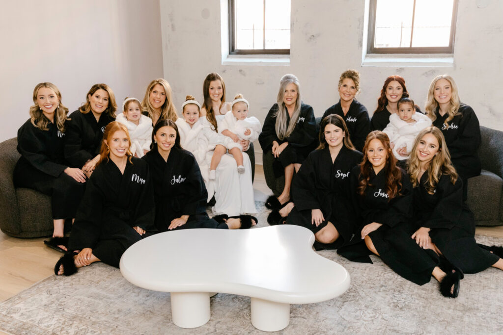 bride with bridesmaids in matching black and white robes