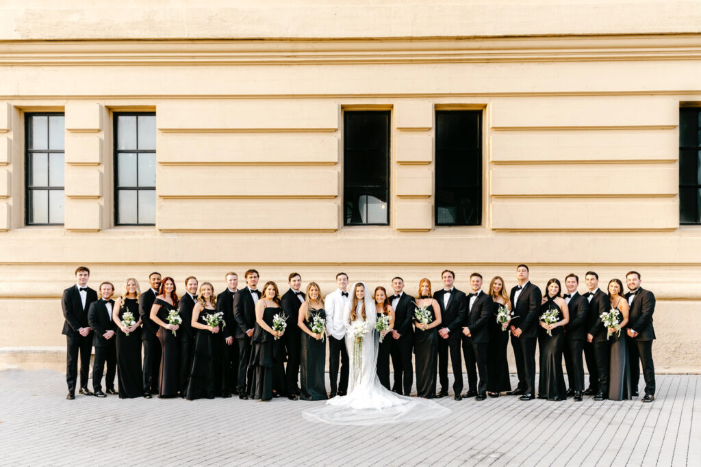 Philadelphia wedding party in all-black attire at The Switch House by Emily Wren Photography