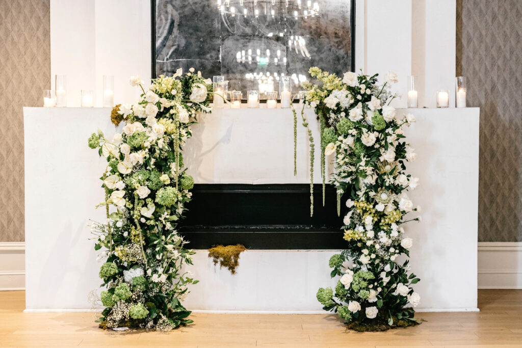 white rose and babies breath floral wedding arch at The Switch House wedding ceremony